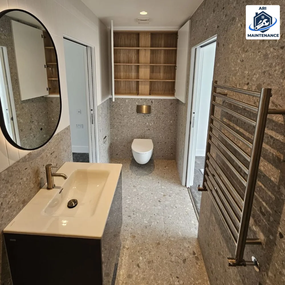 Terrazzo bathroom, oval mirror + sink vanity