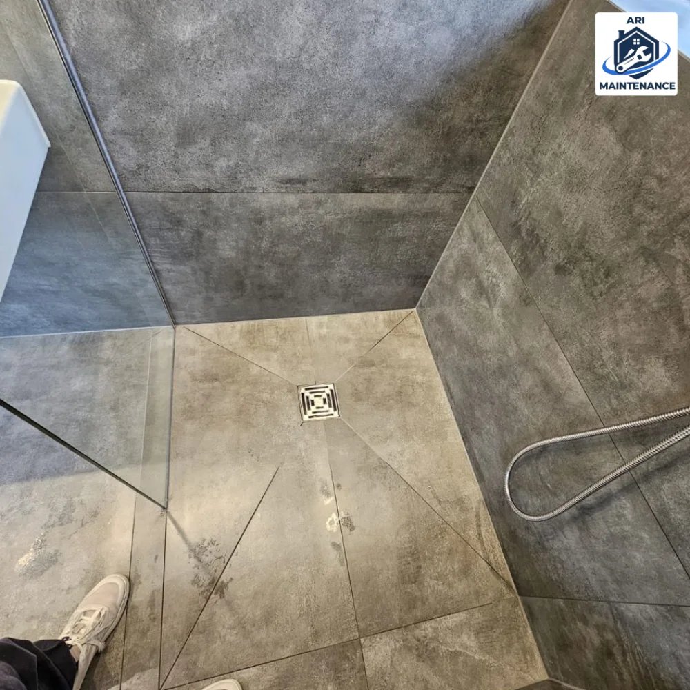 Walk-in shower close-up + drain detail